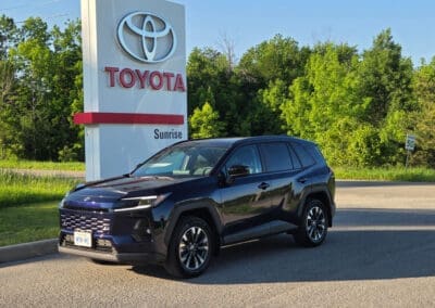 Toyota RAV4 in front of Sunrise Dealership