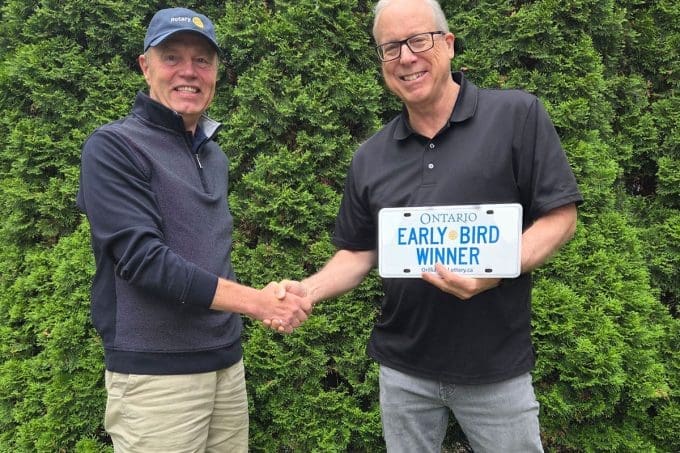2026 1st Early-Bird winner A. Bawks A. Bawks accepting the 2026 first Early-Bird prize from Rotarian Jack Nolan